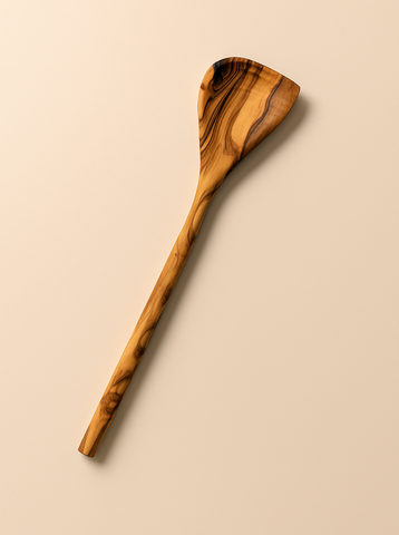 Wooden spoon with a natural finish on a beige background
